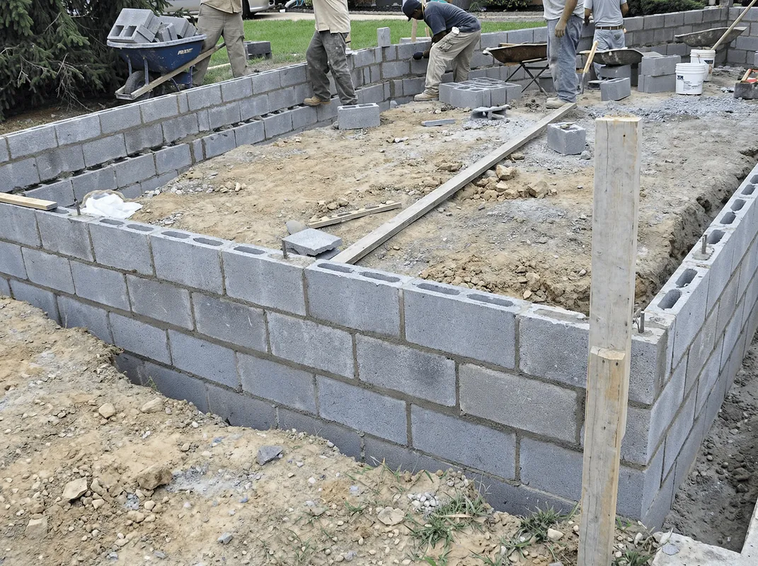 Professionals building a foundation with blocks in Evansville, IN