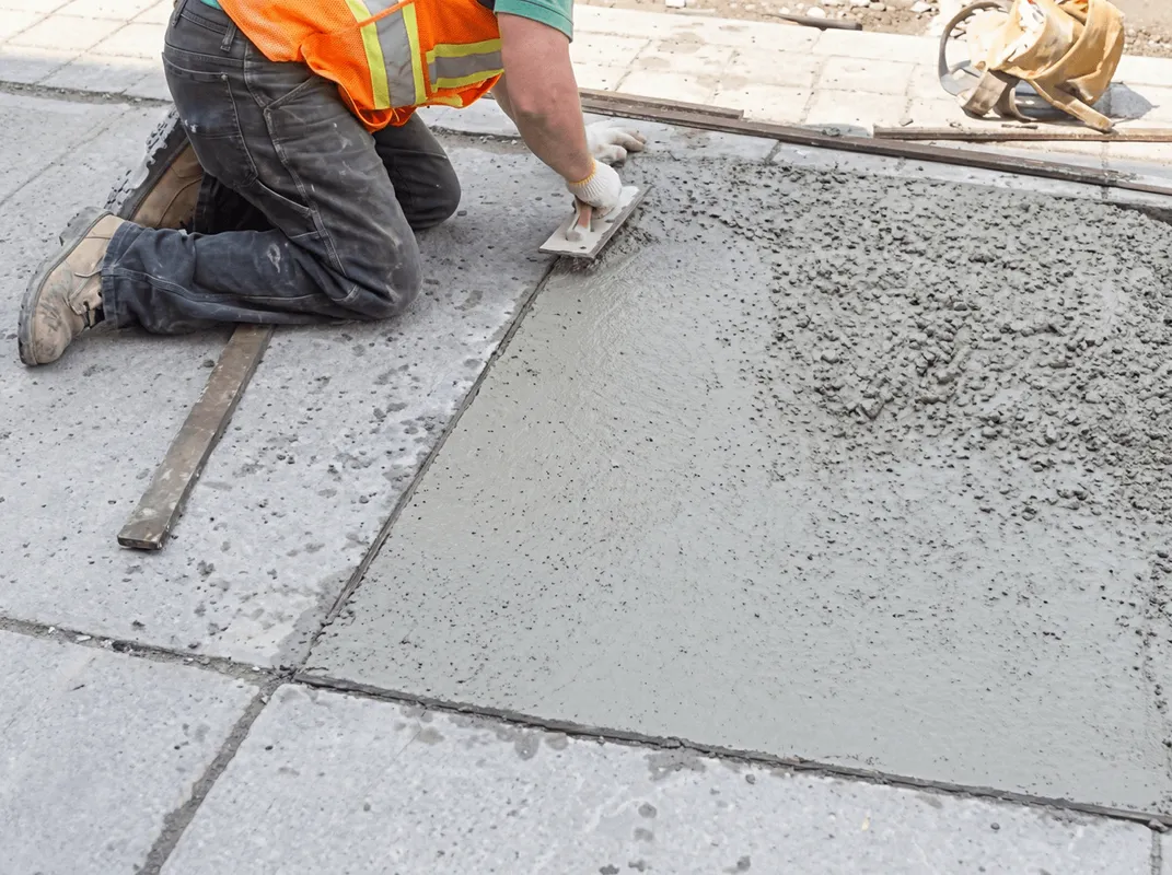 Professional repairing a concrete floor in Evansville, IN